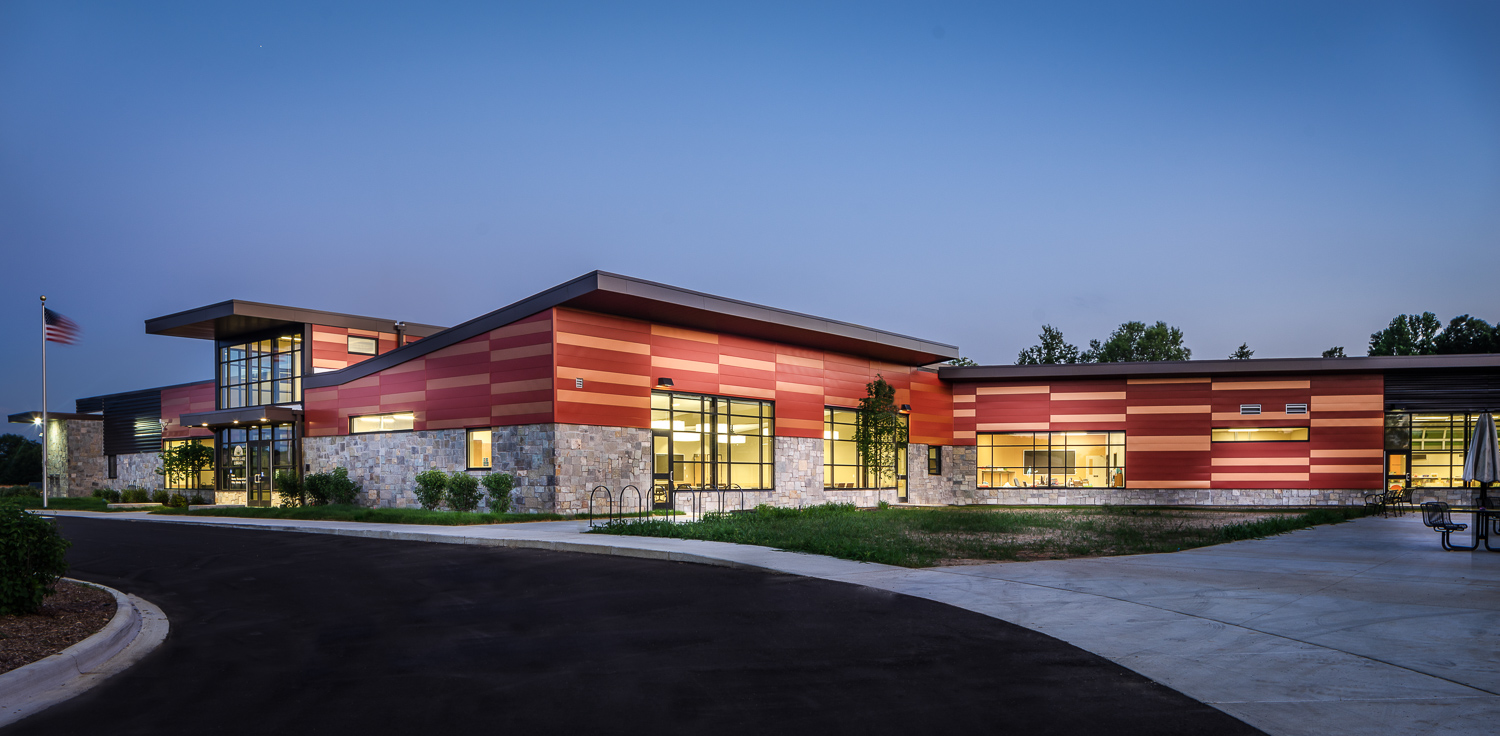 Outside shot of the White Lake Library building taken in the evening. 