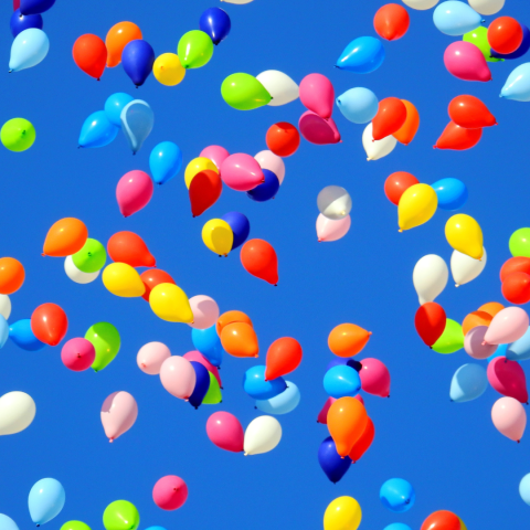 colorful balloons on a blue sky background