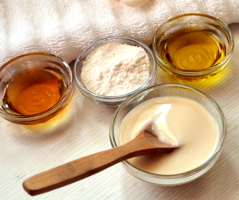 Various items for making homemade spa products laid out on a counter