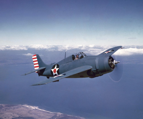 WW2 era plane flying 