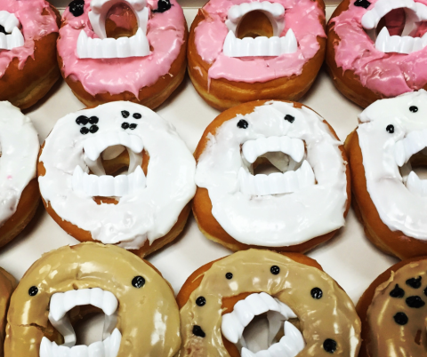 Various frosted donuts with monster faces