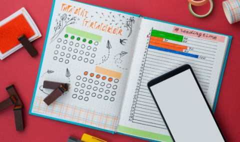 Open journal with pages filled with notes and checklists