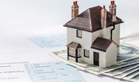 Model house with money and paper forms